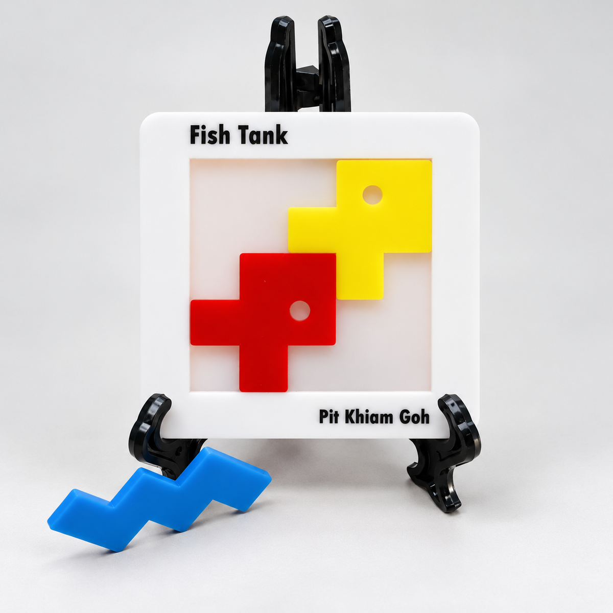 Fish Tank acrylic puzzle with red and yellow fish, loose blue wave and display stand